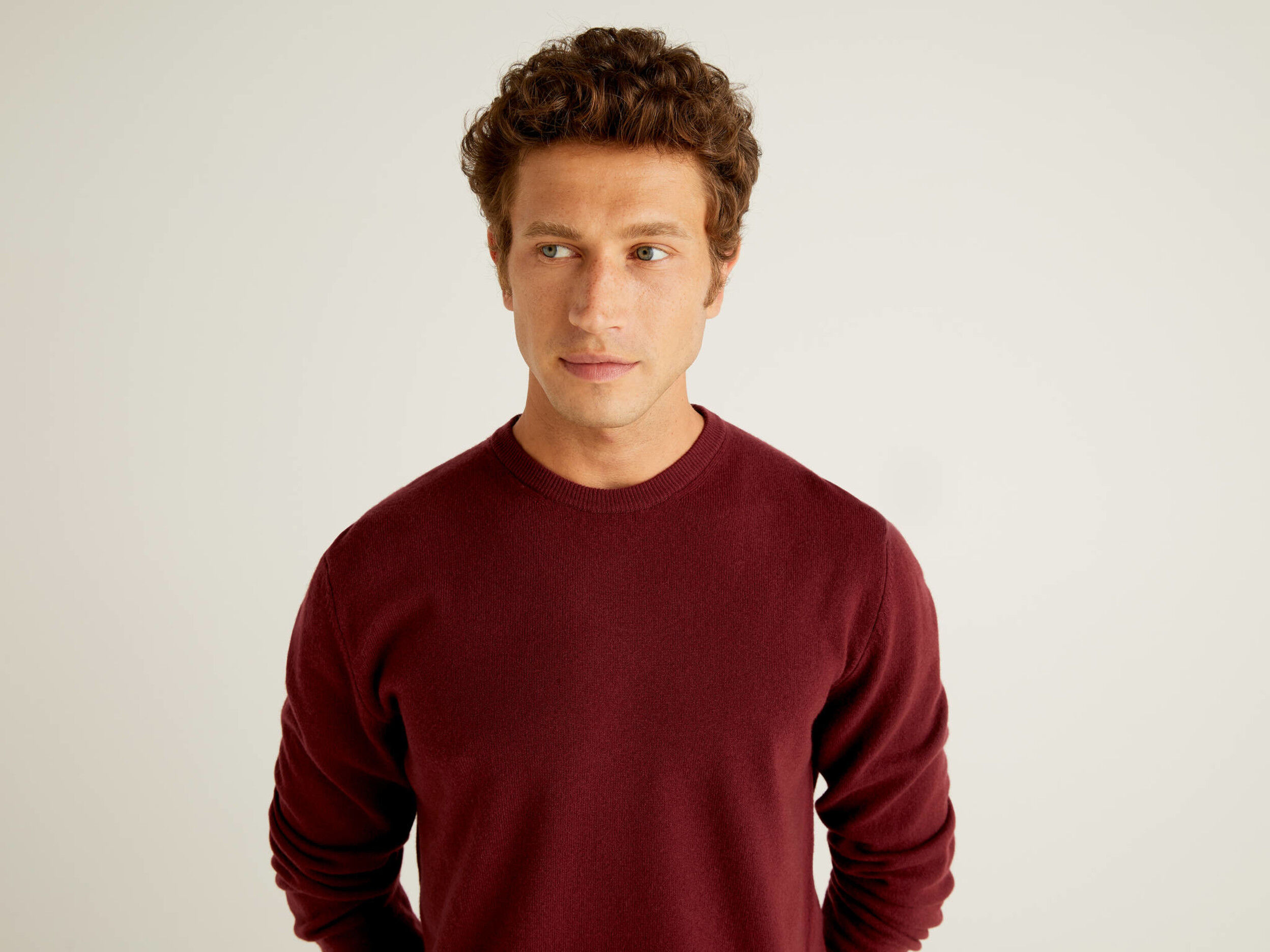Burgundy crew neck sweater in pure Merino wool Burgundy Benetton