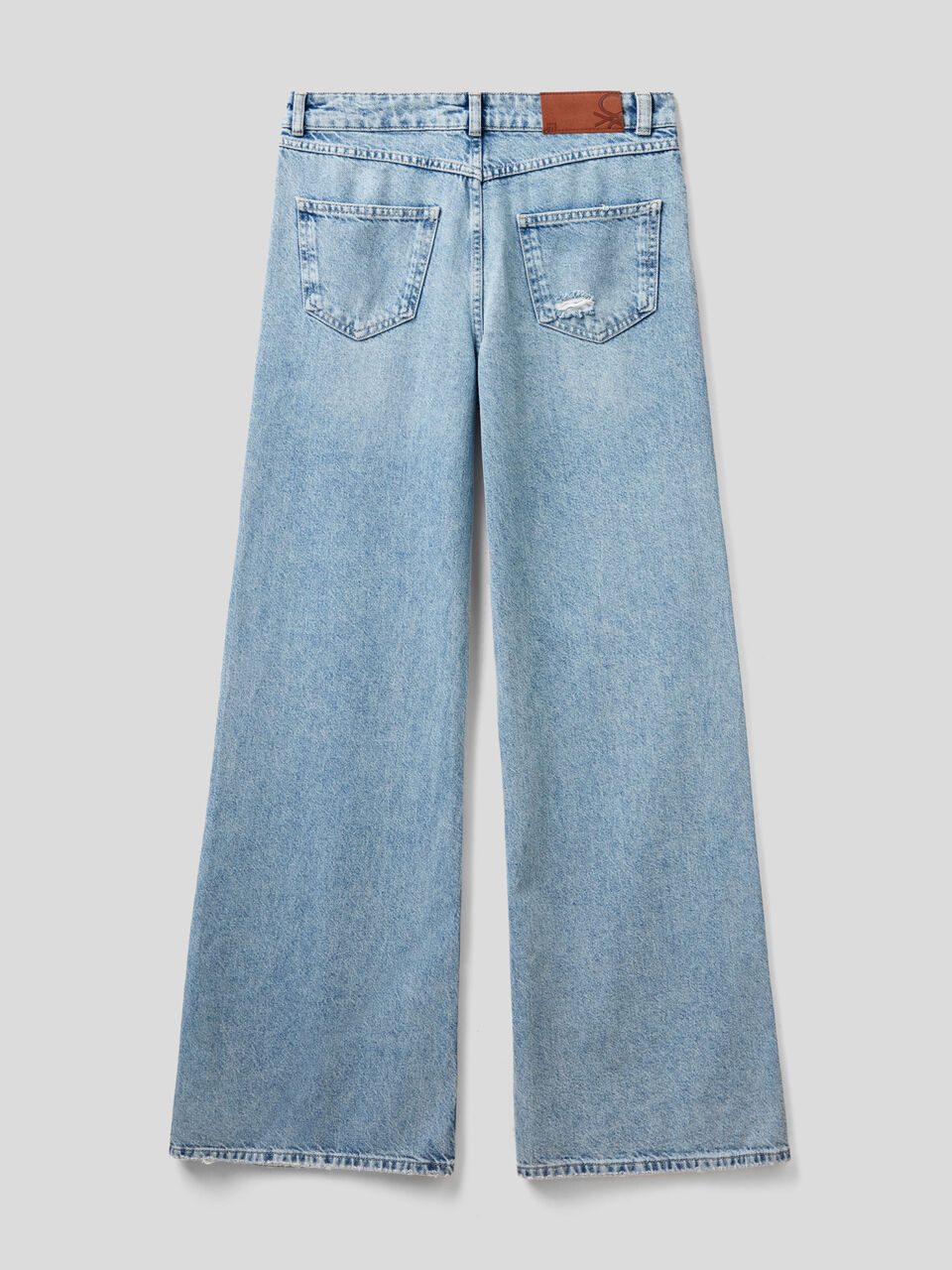 Loose fit jeans with tears - Light Blue | Benetton