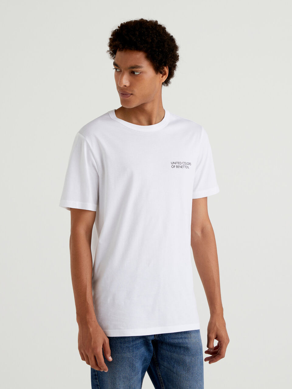 White t-shirt in organic cotton with logo band - Creamy White | Benetton