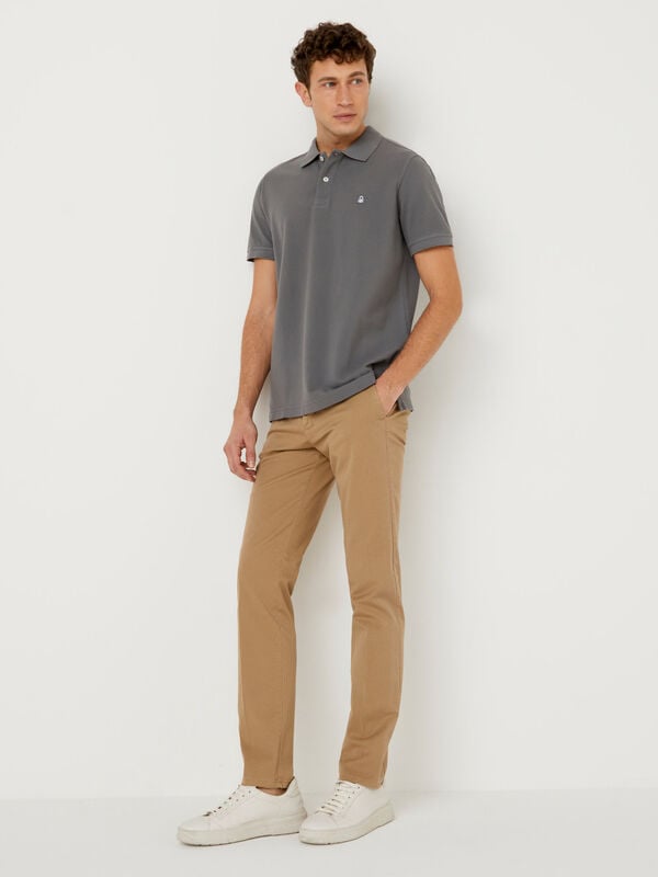 Slim fit chinos with patterned print Men