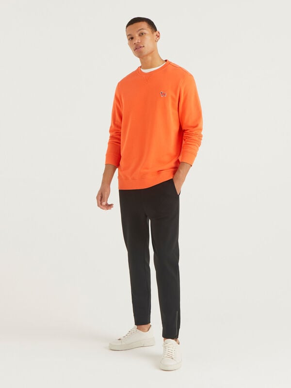 Sporty trousers with side zippers Men