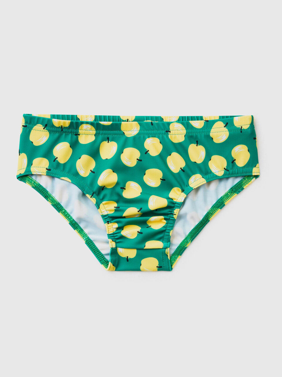 Green swim bottoms with apple pattern
