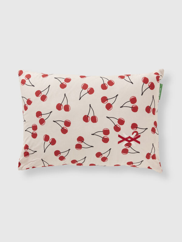 Light pink pillow with cherry pattern