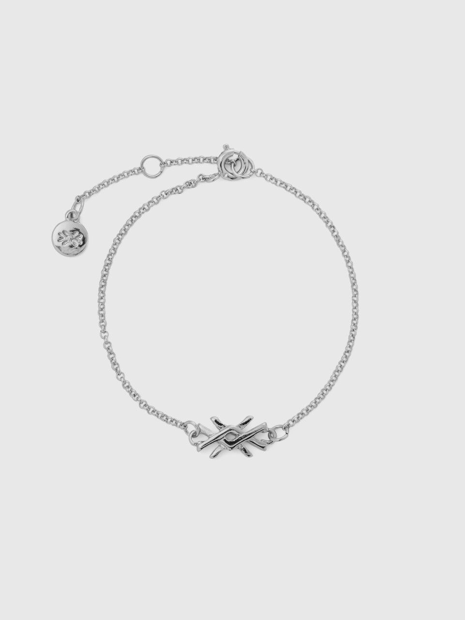 Silver bracelet with charm and logo