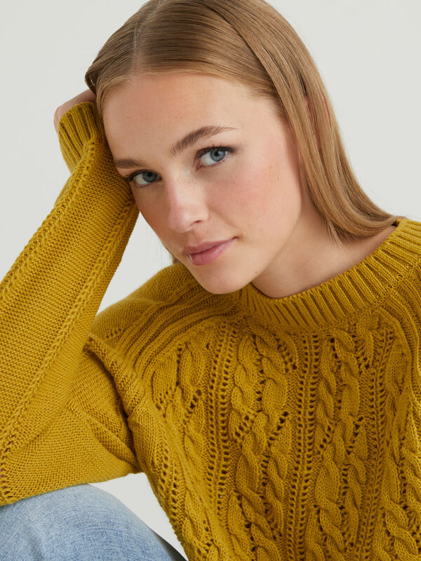 Sweater with cable knit and perforations Women