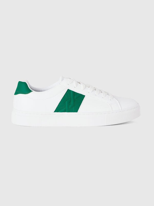 Low-top sneakers with green logo