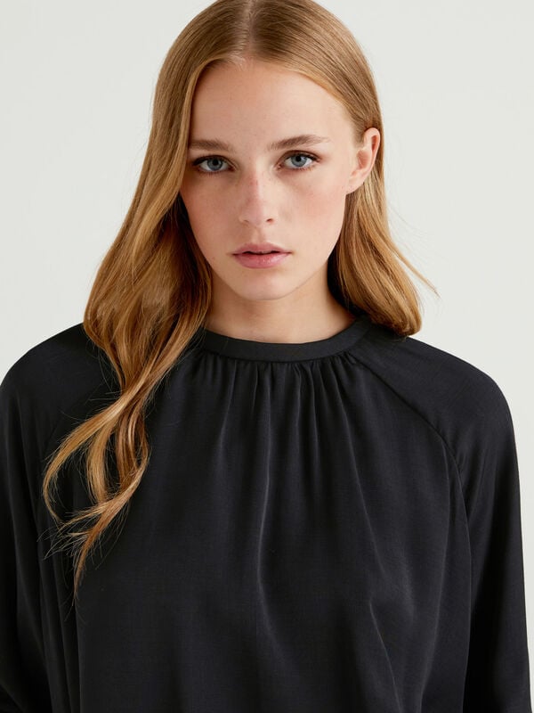 Flared blouse with puff sleeves Women