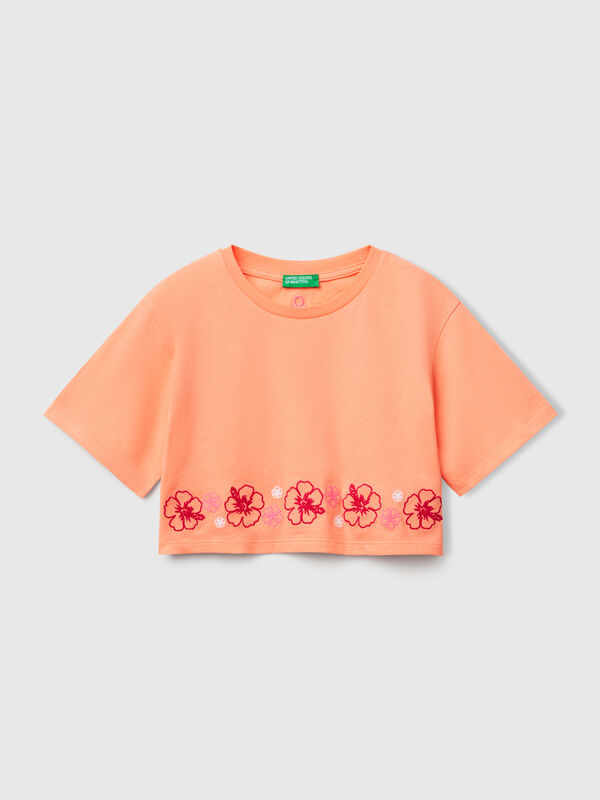 Camiseta naranja con bordado de flores Niña