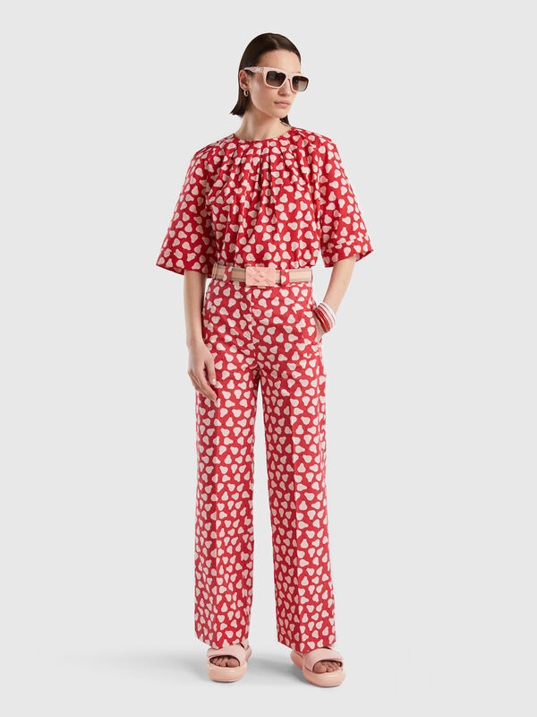 Red palazzo trousers with pear pattern Women