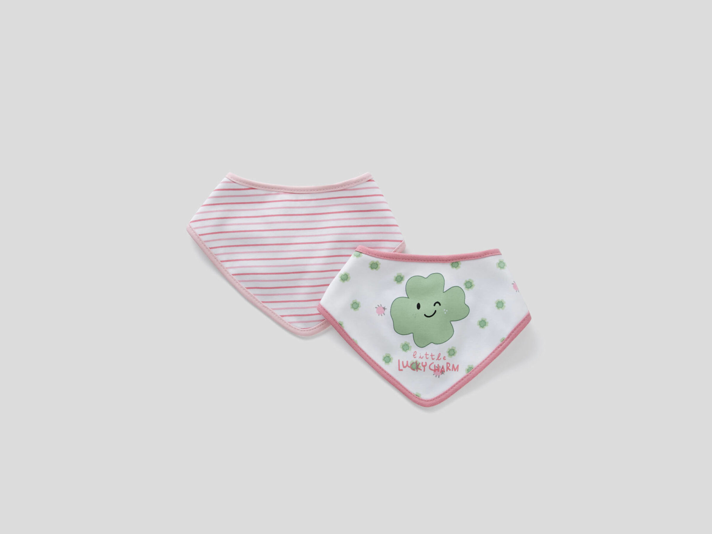 two printed triangular bibs