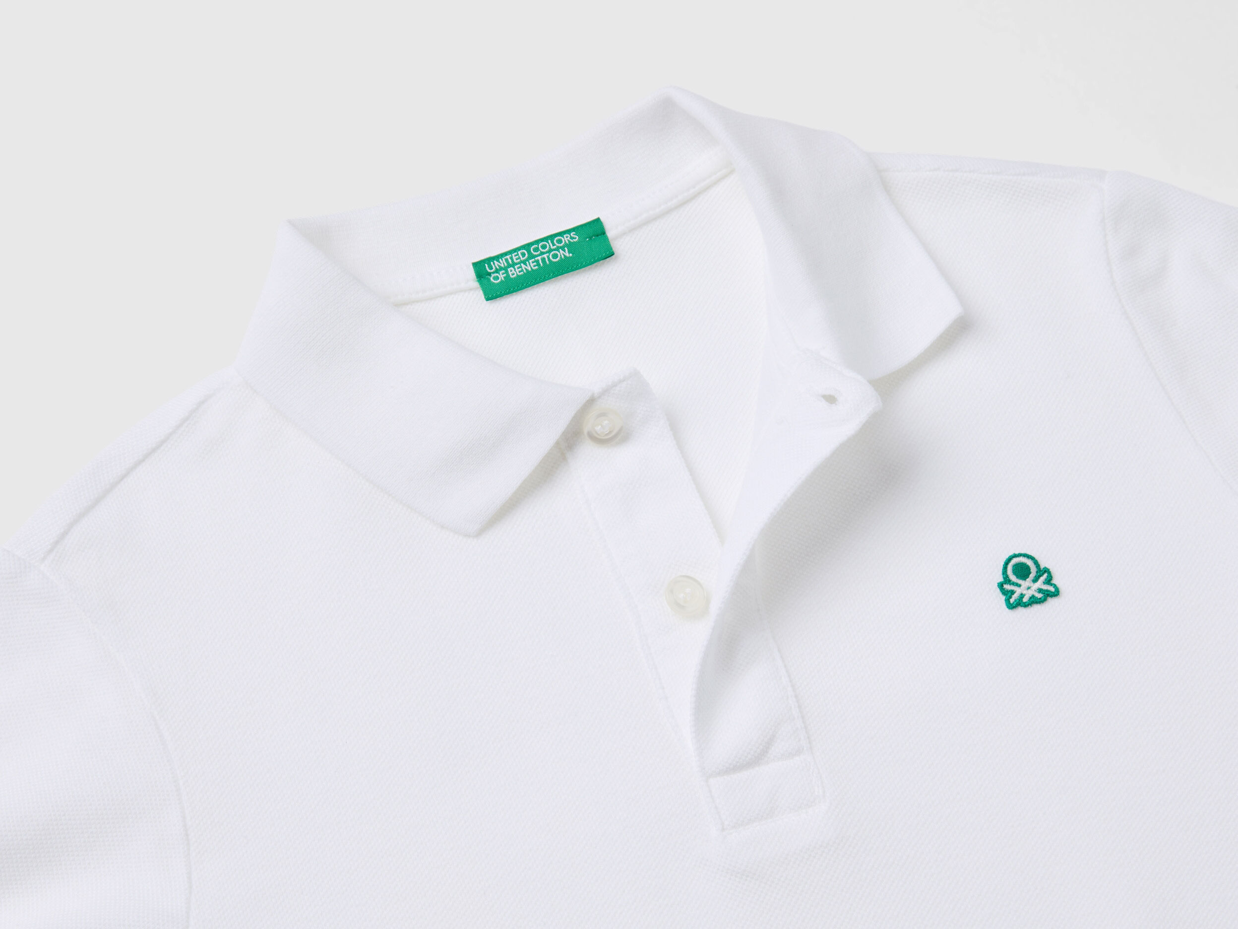 Slim fit polo in 100 organic cotton White Benetton