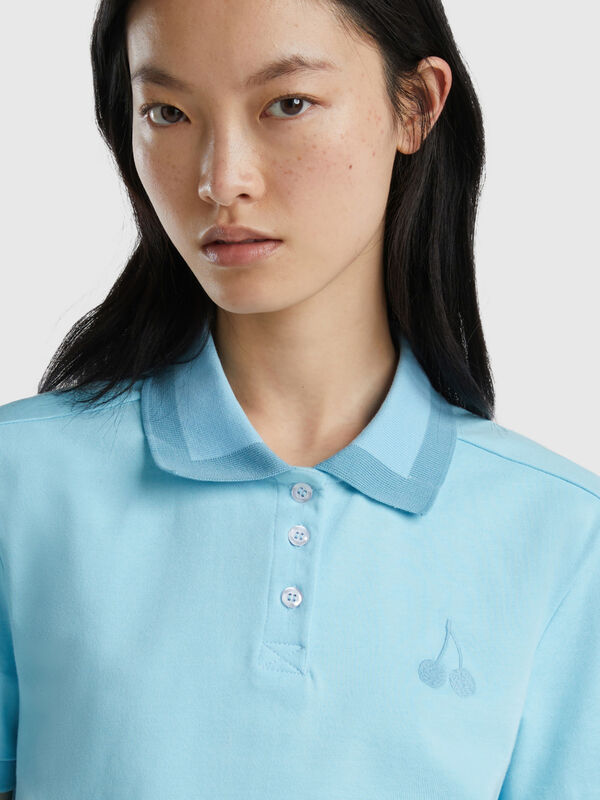 Light blue cropped polo with cherry embroidery Women