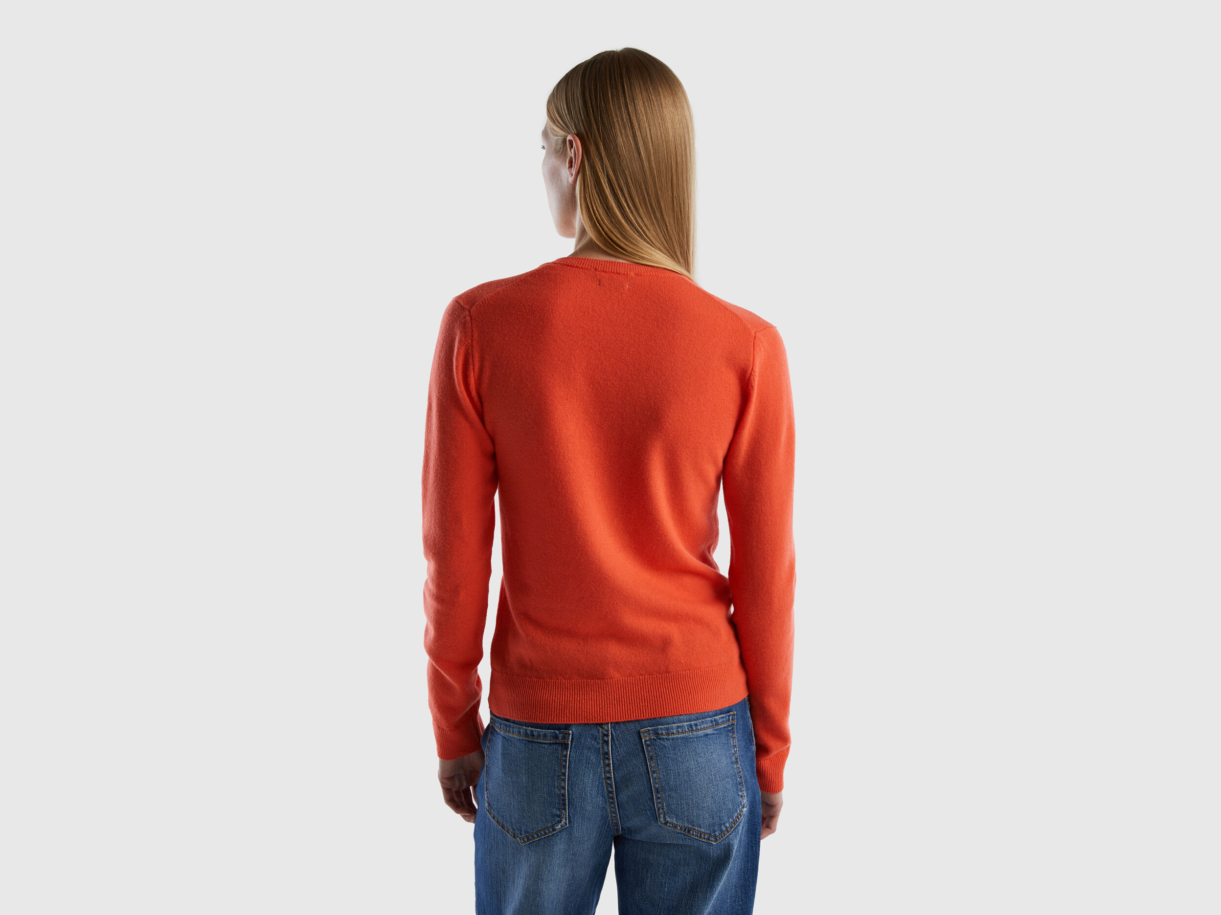 Coral V neck sweater in pure Merino wool Coral Benetton