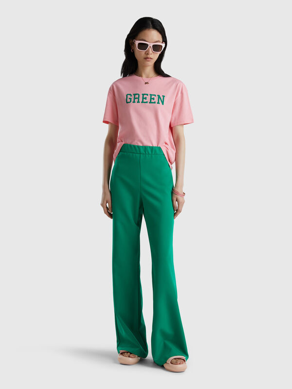 Flared trousers with side zip Women