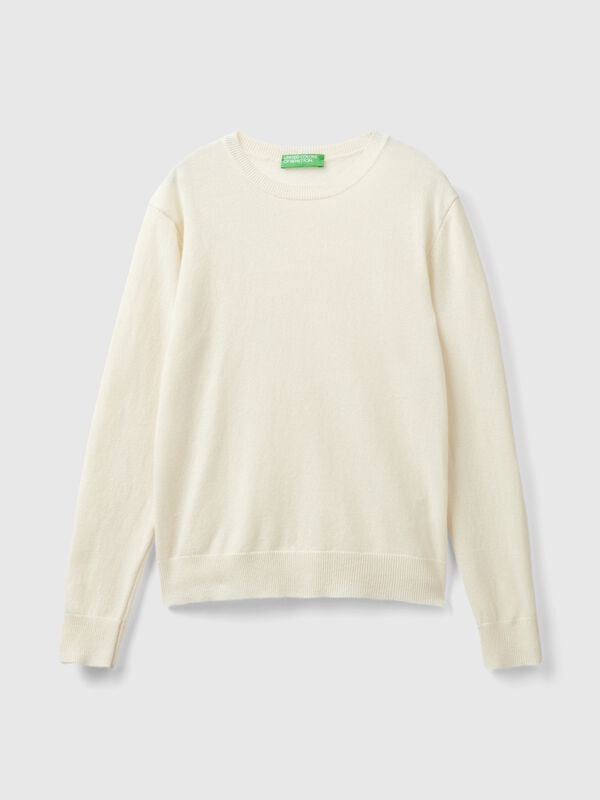 Suéter de cuello redondo color crema en pura lana merino Suéter de cuello redondo color crema en pura lana merino Mujer