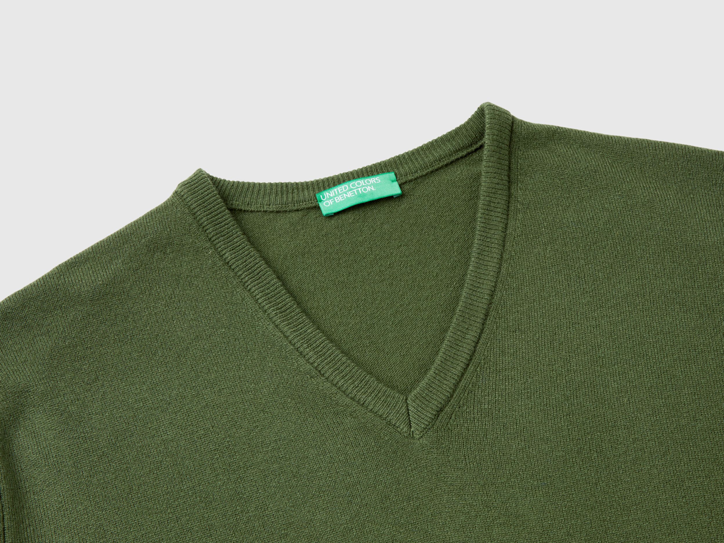 Olive green V neck sweater in pure Merino wool Olive Green Benetton