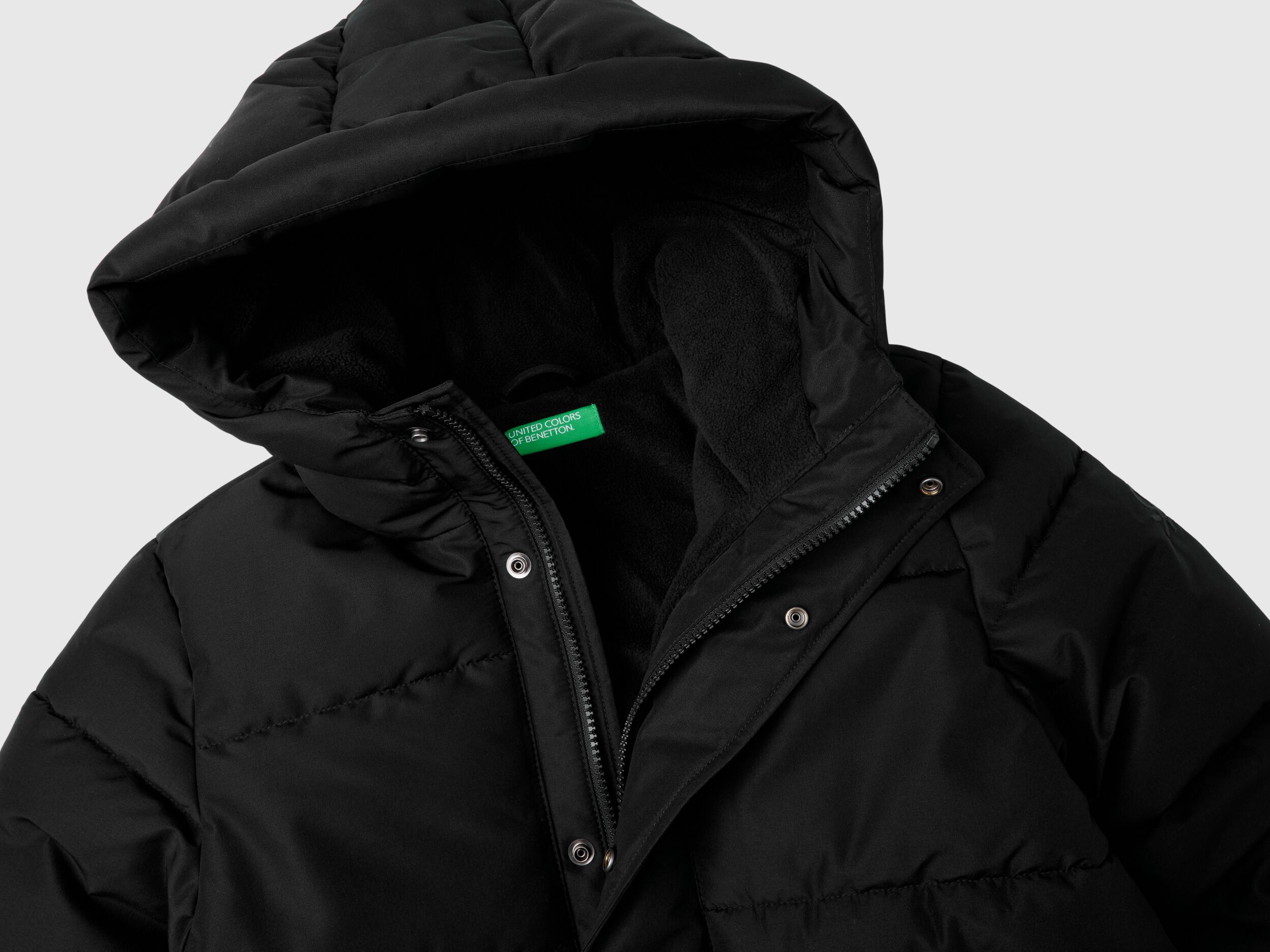 Puffer jacket lined in fleece - Black | Benetton