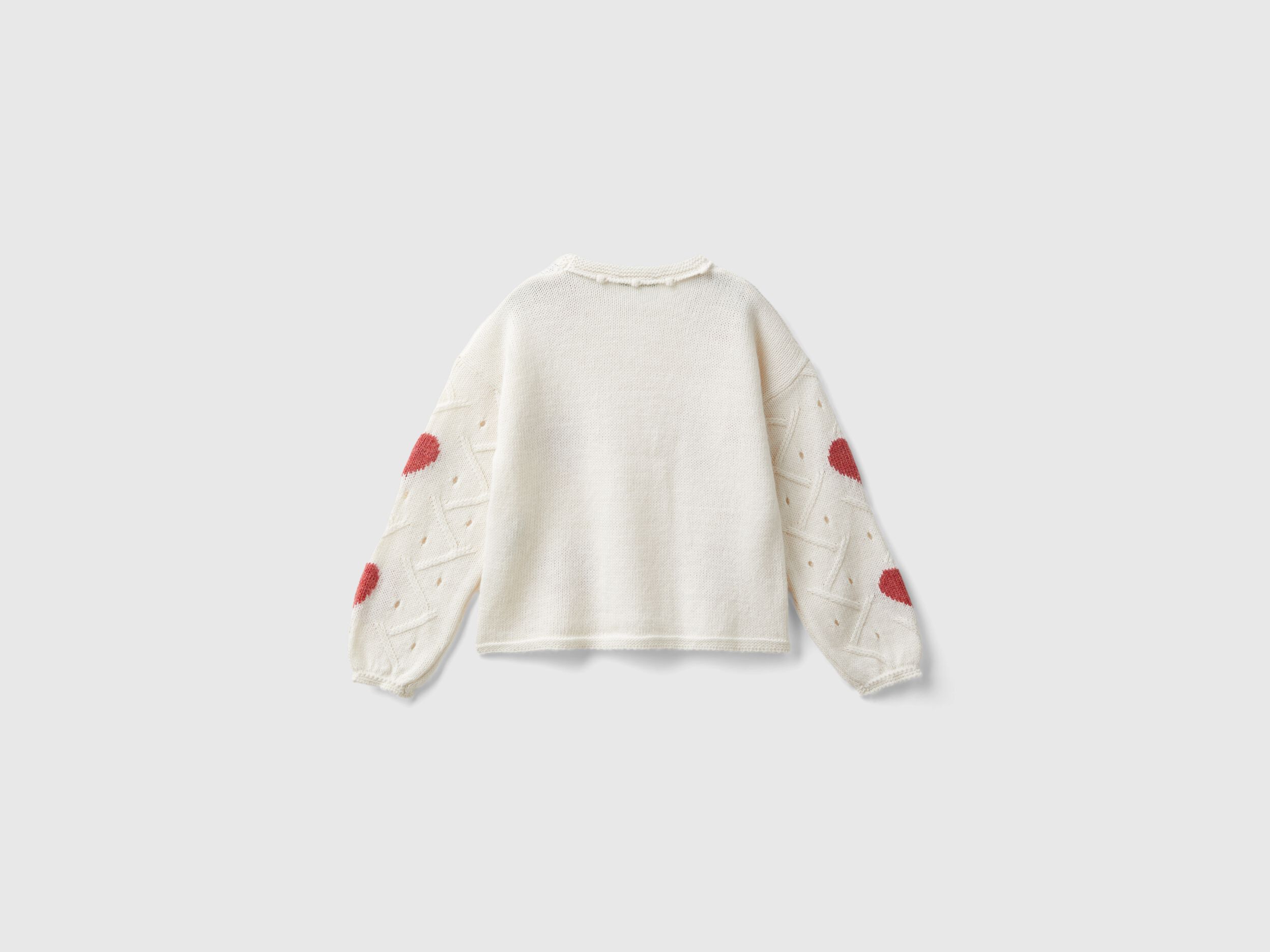 White sweater with hearts on sale