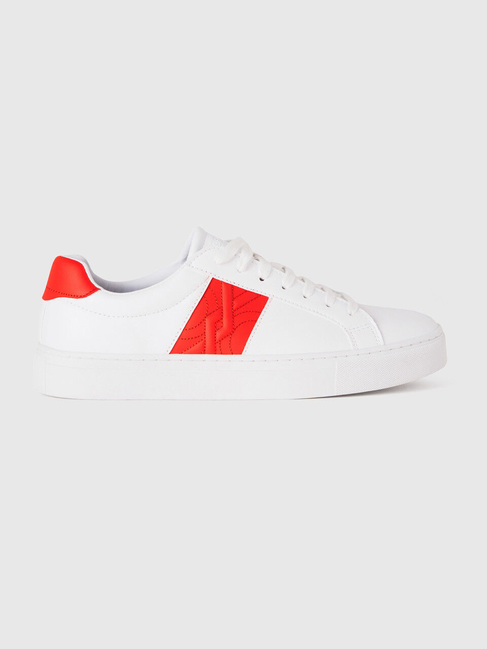 Low-top sneakers with orange logo