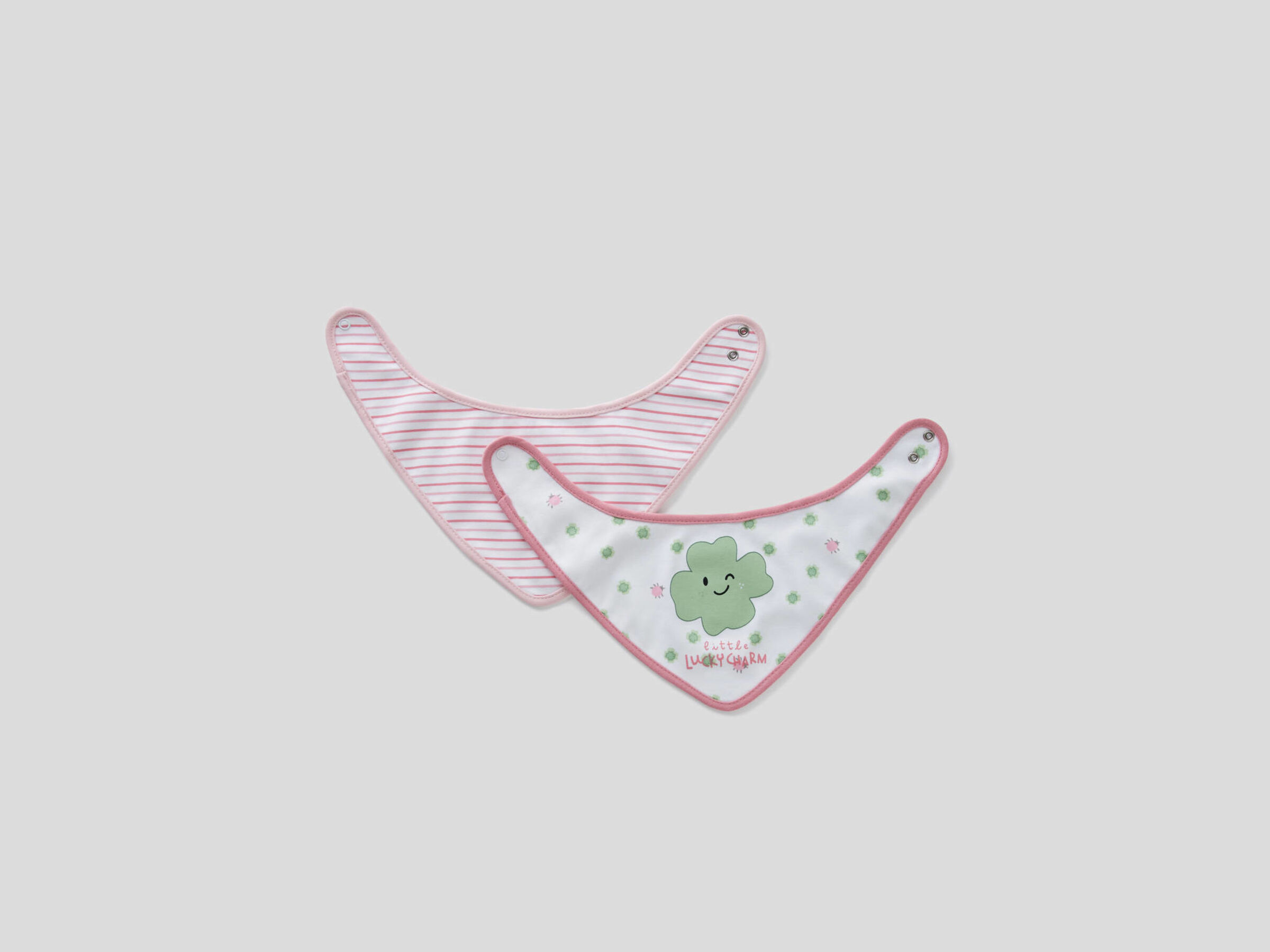 two printed triangular bibs
