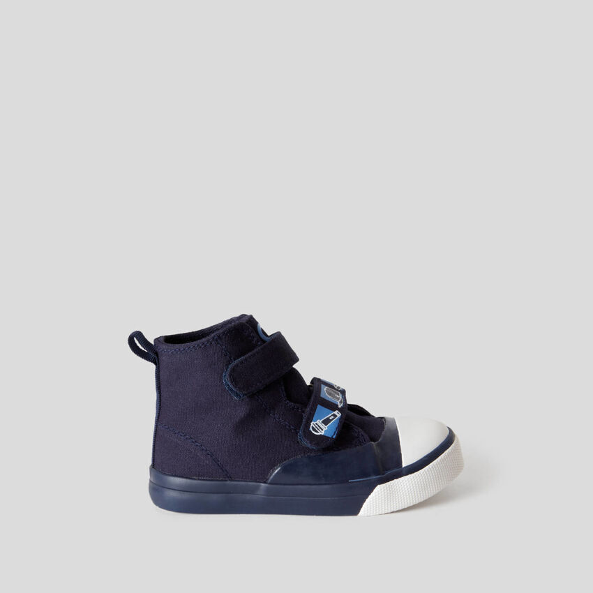 High-top sneakers with strap closure