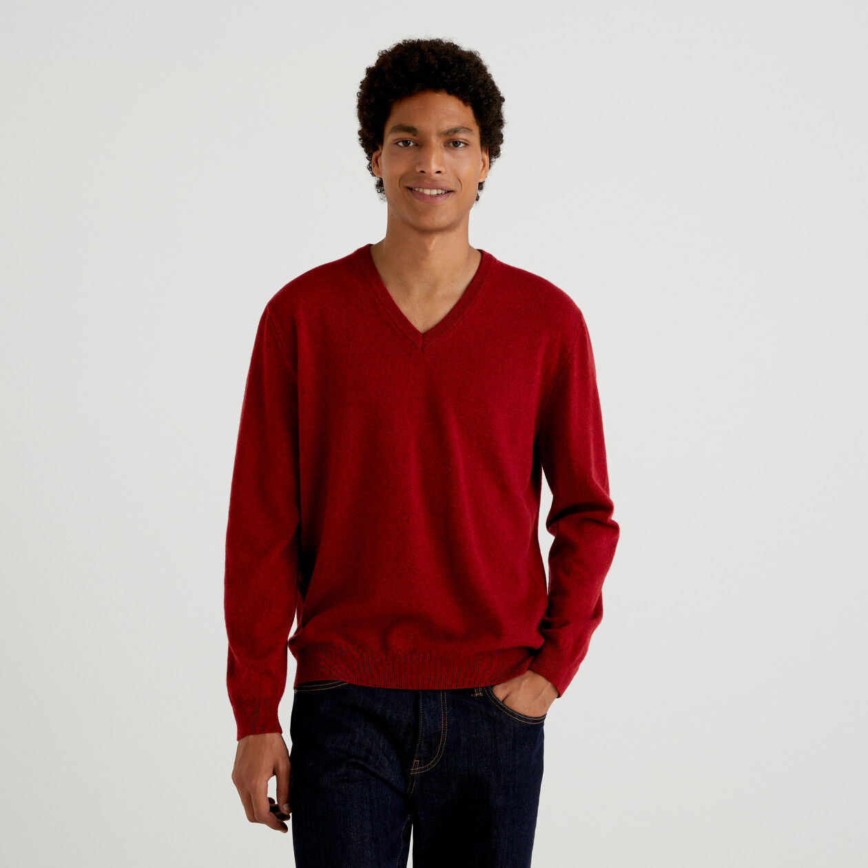 Burgundy V neck sweater in pure Merino wool Burgundy Benetton