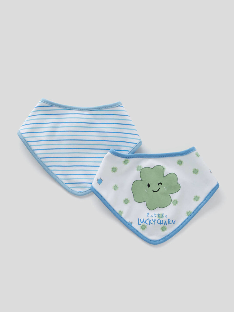two printed triangular bibs