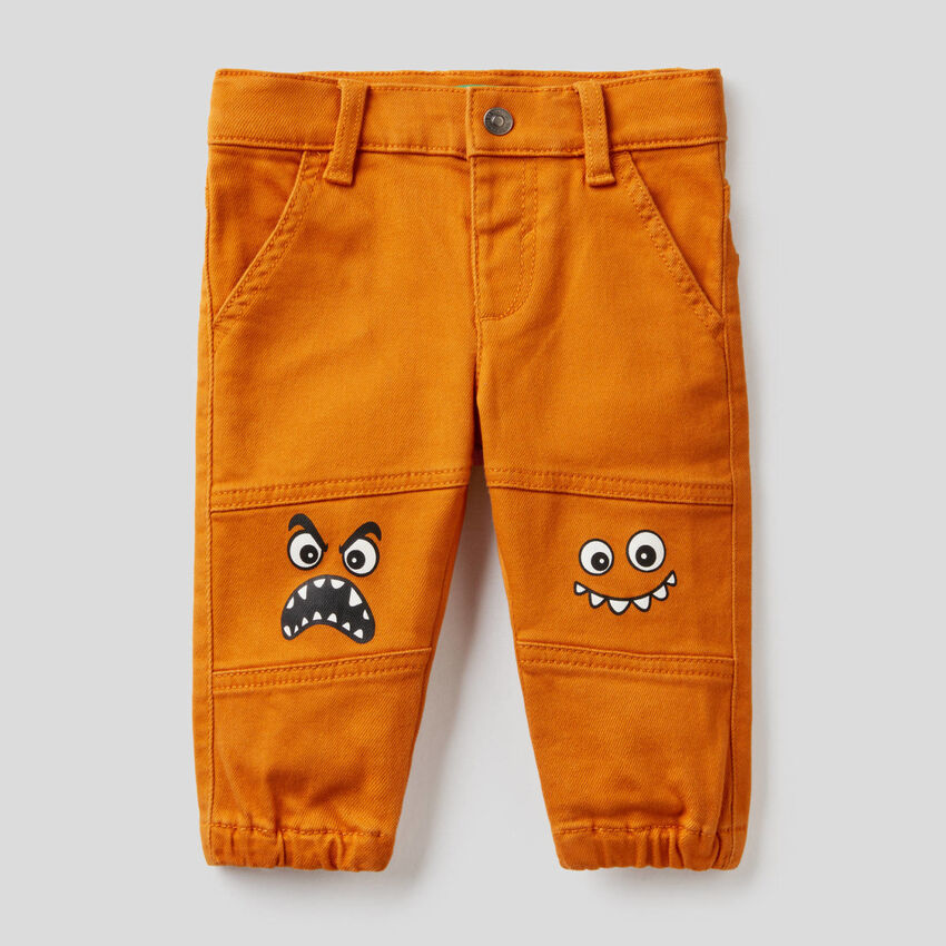 Trousers with character print
