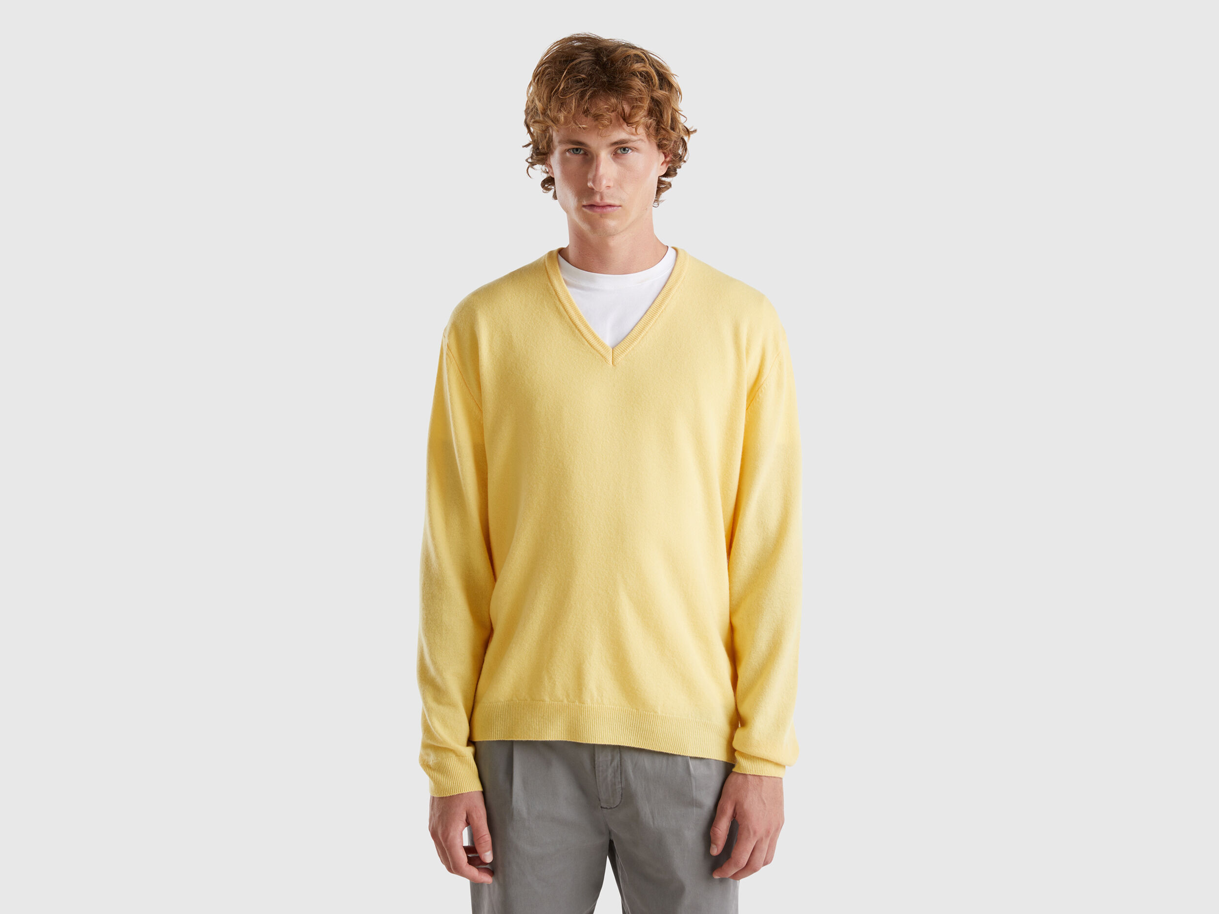 Yellow V neck sweater in pure Merino wool Yellow Benetton