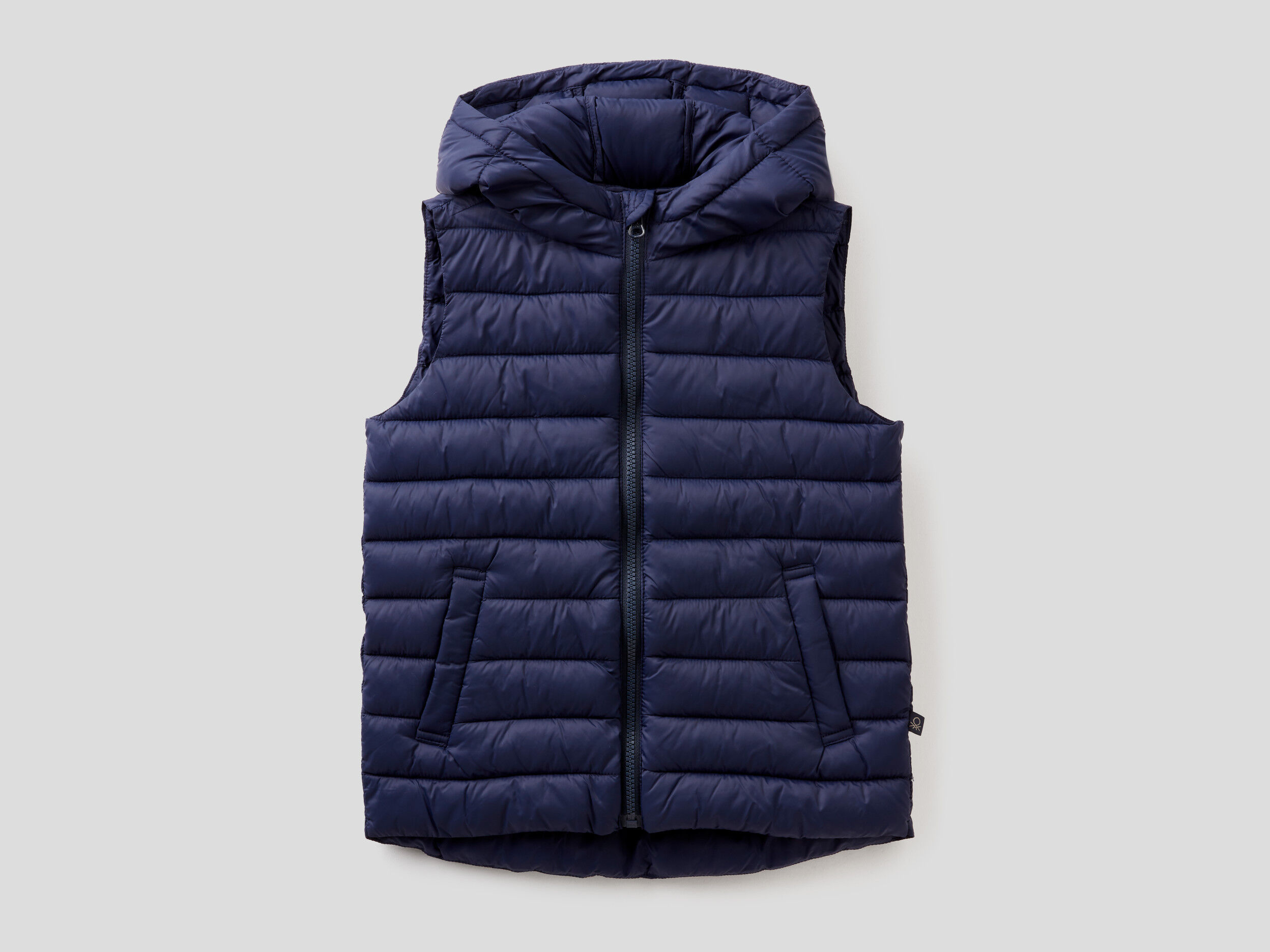 Sleeveless jacket with hood clearance