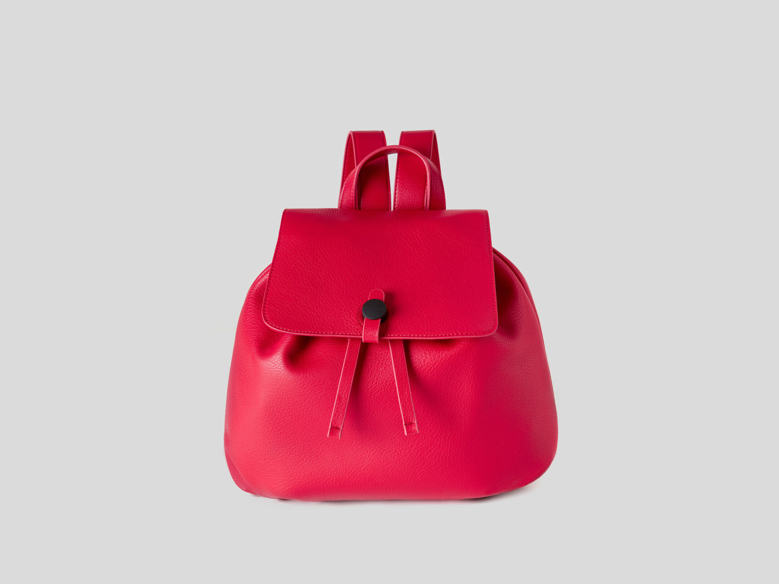 Backpack with top drawstring and flap