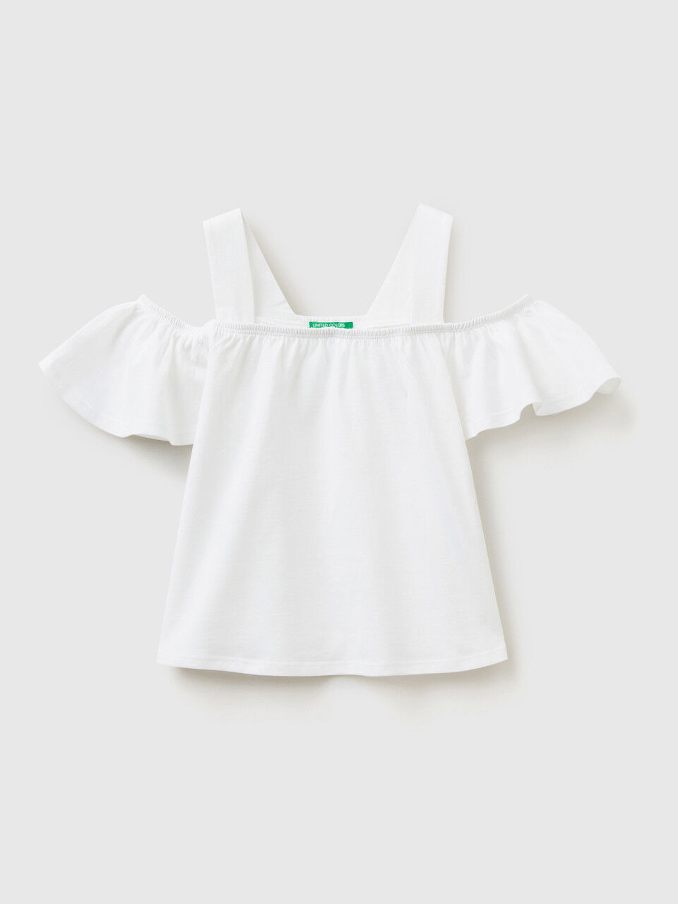 Short top with shoulder straps