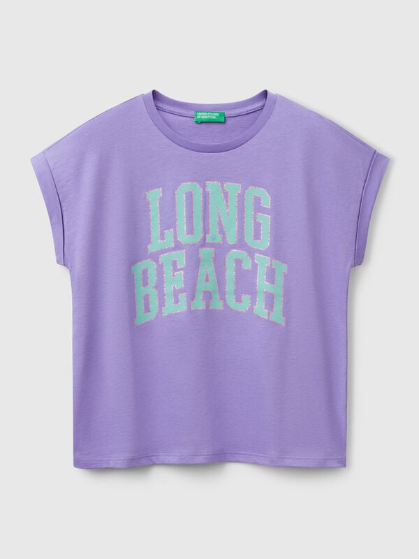 Camiseta boxy fit con estampado y purpurina Niña