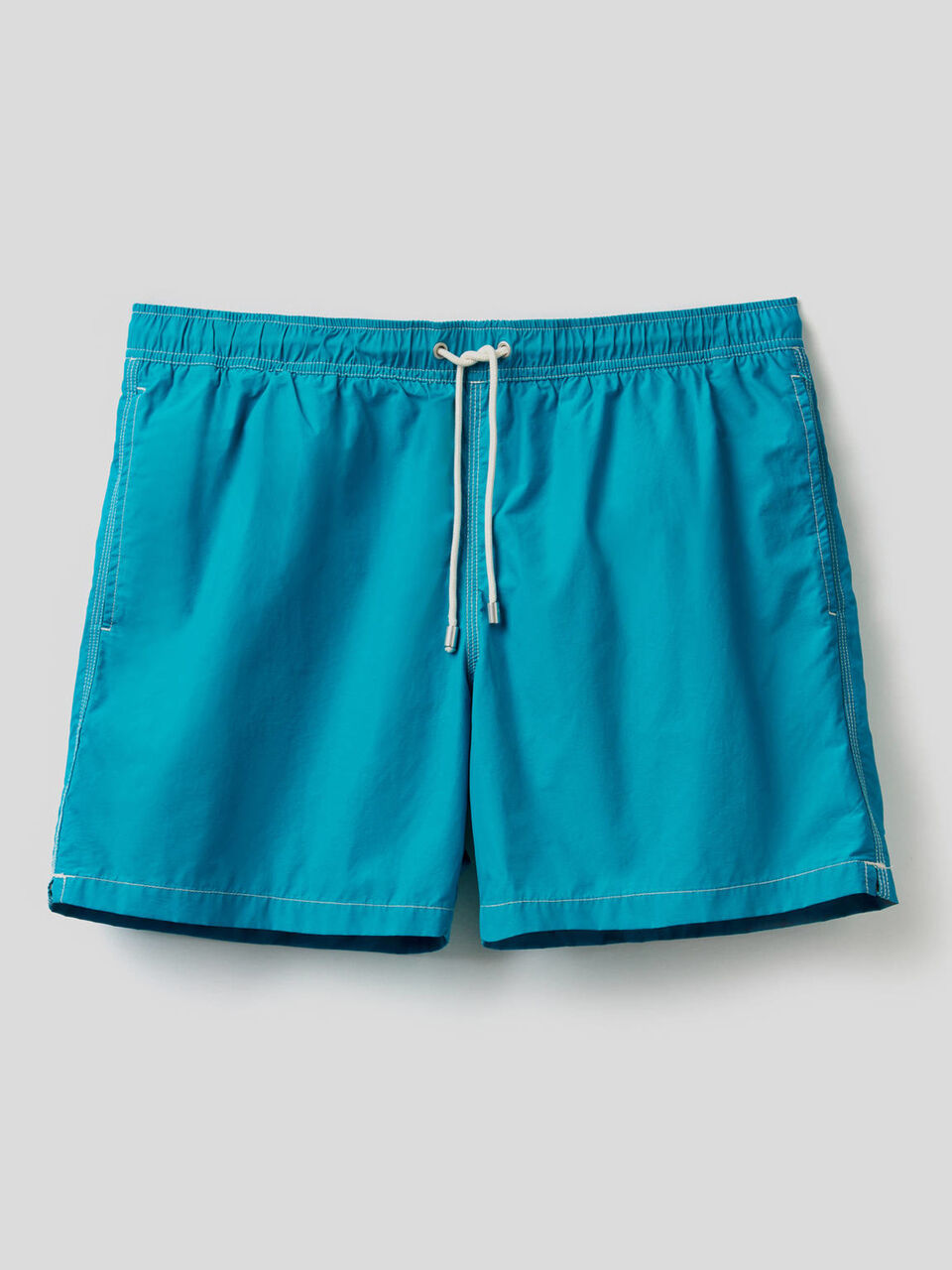Swim trunks with clashing details image number 1