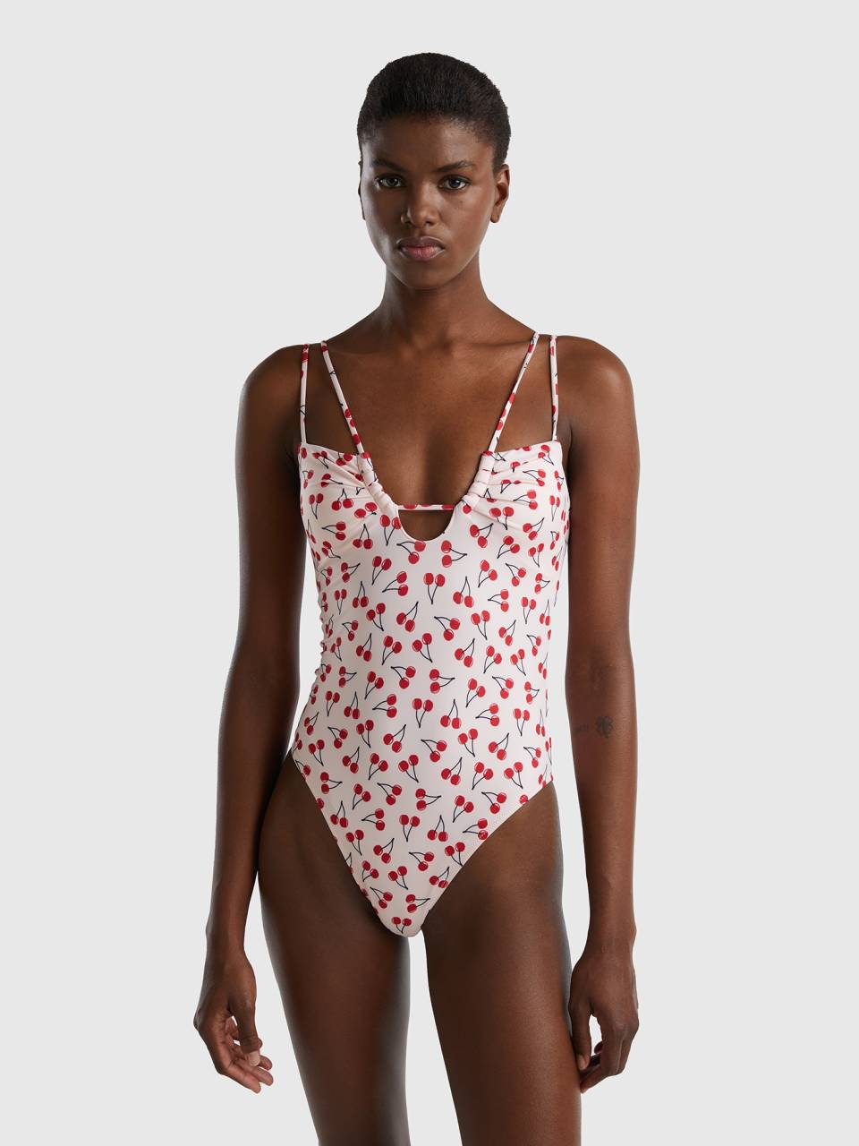 Pink one-piece swimsuit with cherry pattern - Pink | Benetton